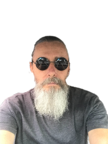 Just a selfie from the chest up. 

A particularly handsome, debonair man wearing round sunglasses. He has a magnificent beard and his luscious long hair is pulled back in a ponytail - which you can't see.