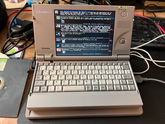 a tiny toshiba libretto notebook running DOStodon