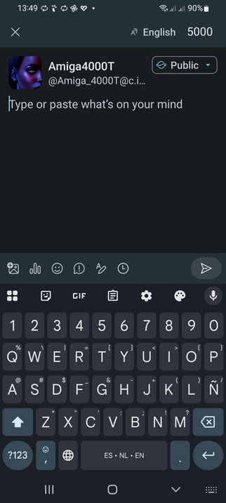 The image shows a screenshot of a messaging app interface. At the top, the status bar displays the time as 13:49, a Wi-Fi signal, full battery at 90%, and the language set to English with 5000 notifications. Below the status bar, there is a profile section with the username "Amiga4000T" and the handle "[@]Amiga_4000T[@]c.i...". The profile is set to "Public". The text "Type or paste what's on your mind" is displayed, indicating the user can input text. The keyboard is visible at the bottom, featuring a dark theme with white text, including numbers, letters, and various symbols. Icons for adding images, GIFs, and other features are present above the keyboard.

 Ovis2-8B

🌱 Energy used: 0.196 Wh