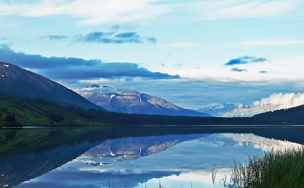 View of Summit Lake Alaska with reflections of the sky