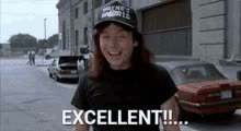 Wayne from Wayne's World movie GIF, shruging, giving thumbs up, caption says "Excellent!" 