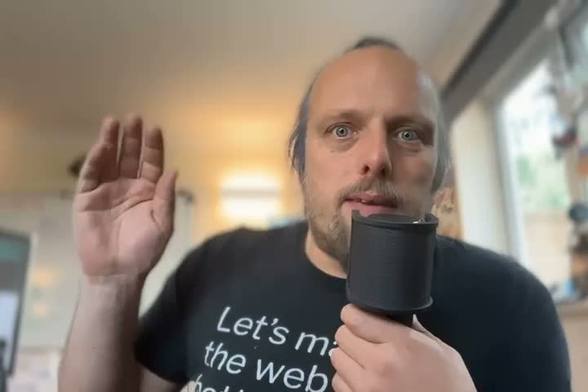 Video introduction: a white man with blue hair tied in a ponytail, a goatee beard, and stubble, waves to the camera, saying, in an accent representative of various bits of Northern Great Britain: "Hi, I'm Dan Q; I'm not good at giving short introductions so let's really belt this one out. I'm a queer poly geek, blogger, software engineer, founder of a volunteer-run nonprofit, geocacher, geohasher, cyclist, and magician. Say hi!"