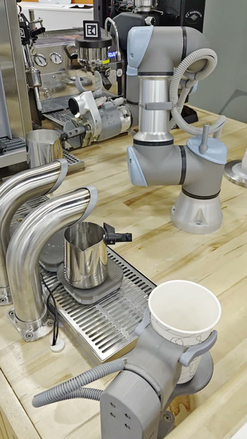 Video of a robotic arm making a latte, even pouring the frothed milk into the tilted cup so as to make a heart pattern in the foam.

The robot uses cameras and AI to do things like evaluate the foam quality and decide what pattern will work best, or that the porta filter needs extra cleaning.